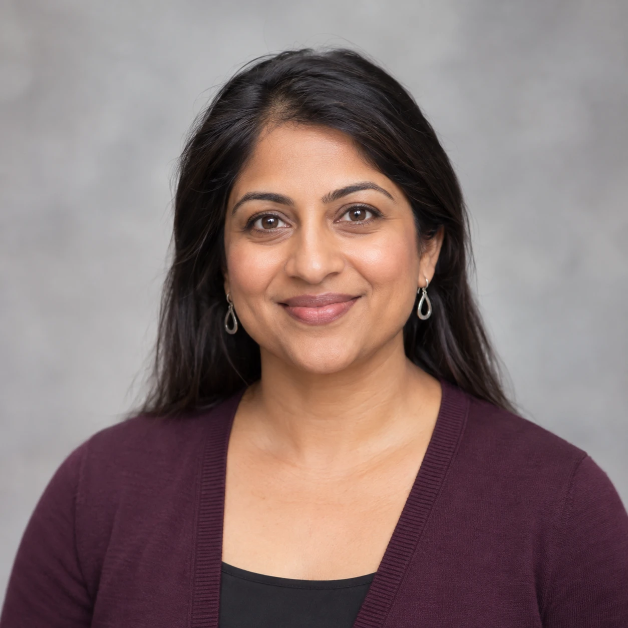 AI-generated portrait of Priya Shah, fictional demo staff member