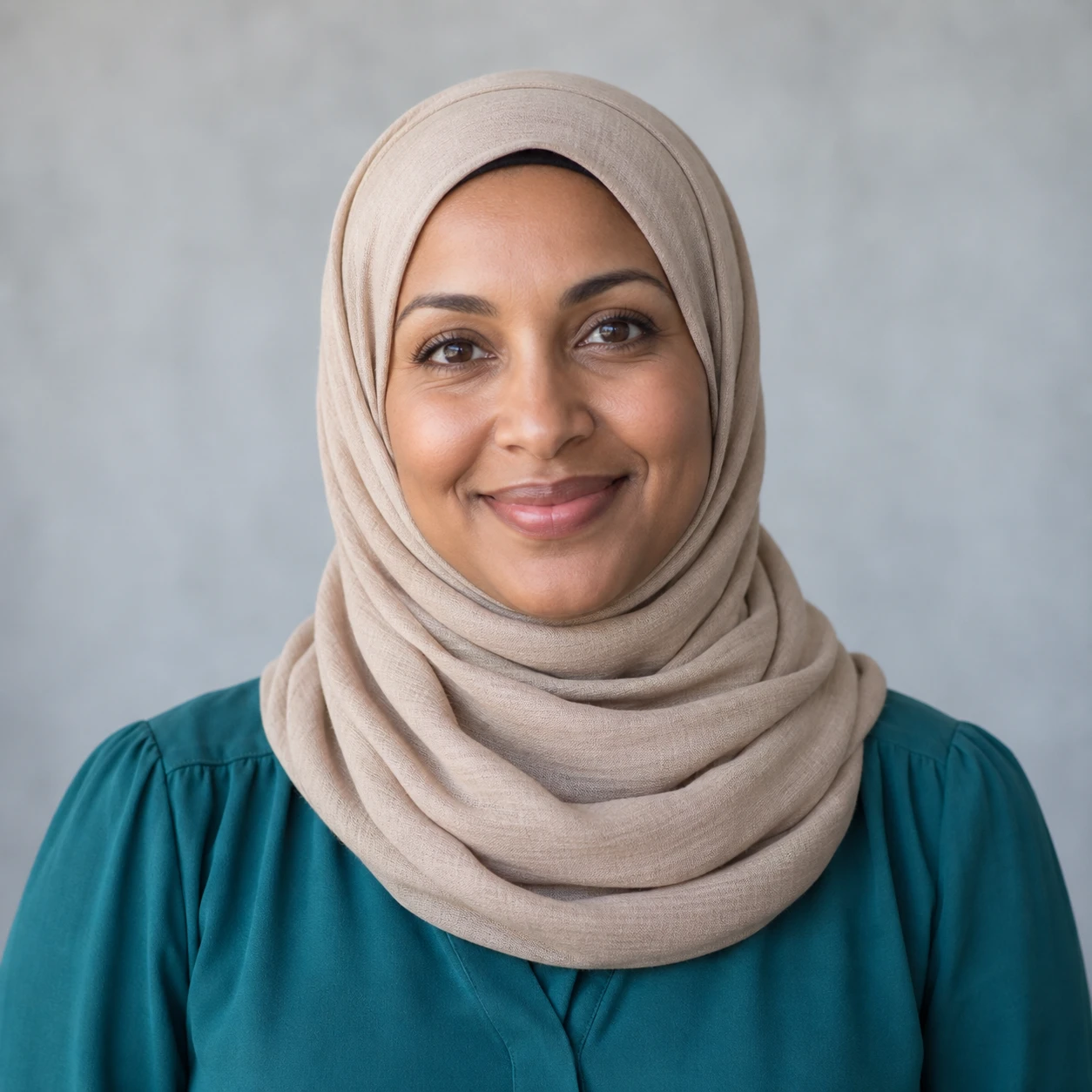 AI-generated portrait of Amina Hassan, fictional demo staff member